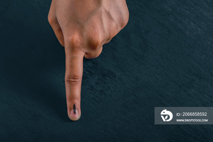 Indian Voter hand with voting sign after casting vote in election