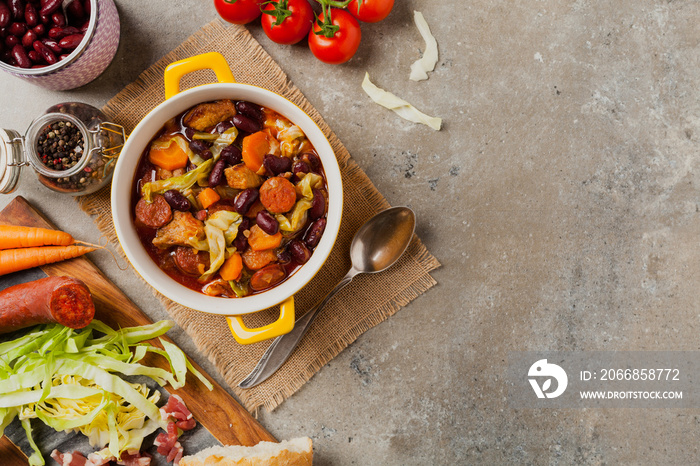 Traditional portuguese goulash with cabbage, beans and ribs.