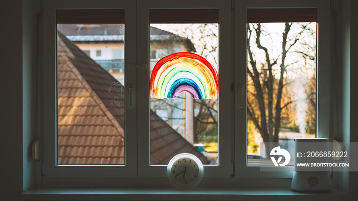 Close-up photo of painting rainbow on window