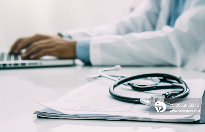 doctor at work in hospital office.