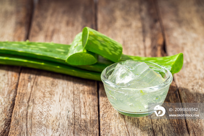 Jelly aloe vera in bowl on wooden table.