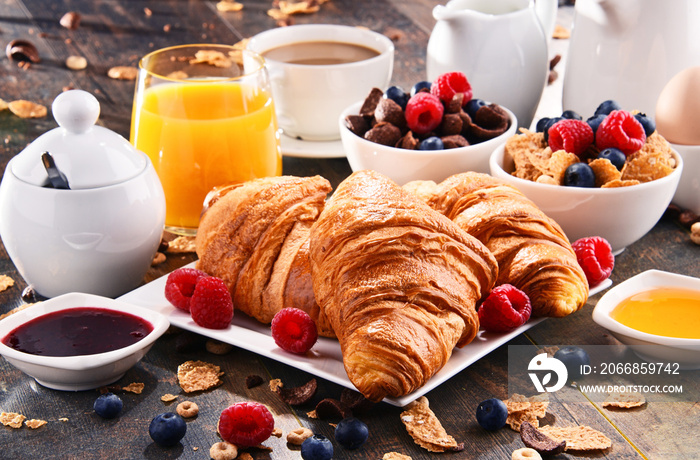 Breakfast served with coffee, juice, croissants and fruits