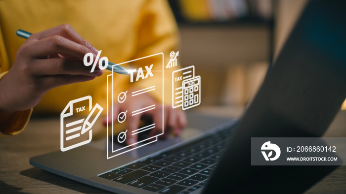 Corporate and individual tax payment concept, woman using computer filling out corporate and personal income tax return, VAT and property tax of business.