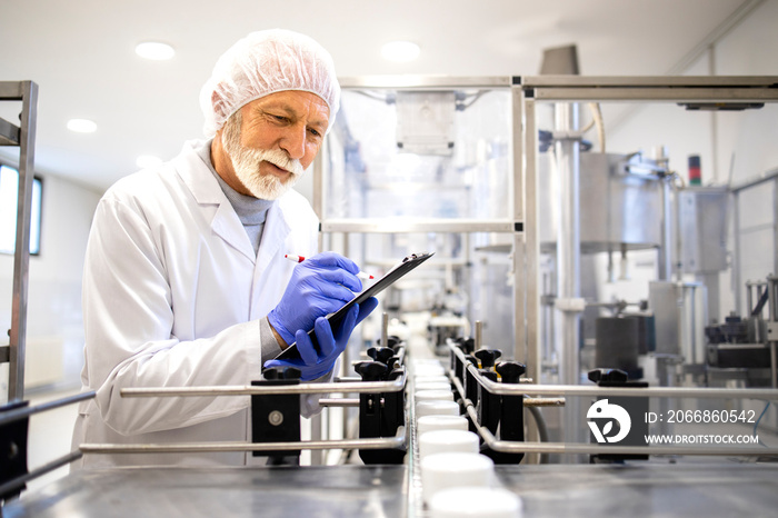 Pharmaceutical technologist working in cosmetics factory.