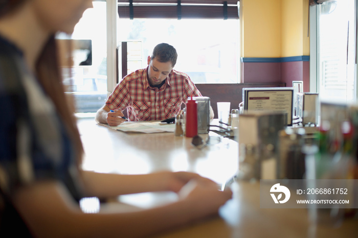 man reviewing map at restaurant