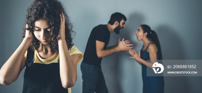 crying girl with parents dispute in home