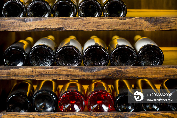 wine bottles on wooden shelves