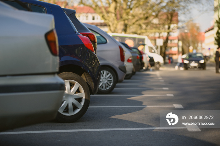 View of tightly packed cars in parking lot