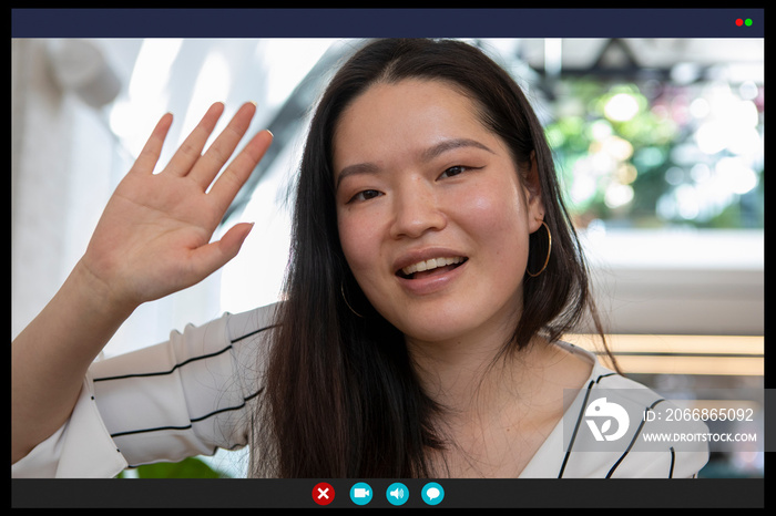 Smiling woman waving in video call