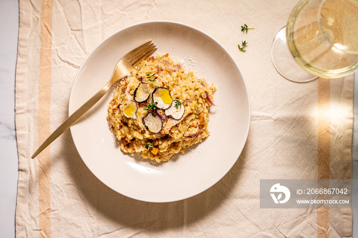 Homemade orzo risotto pasta with wild mushrooms, white wine, and  truffles