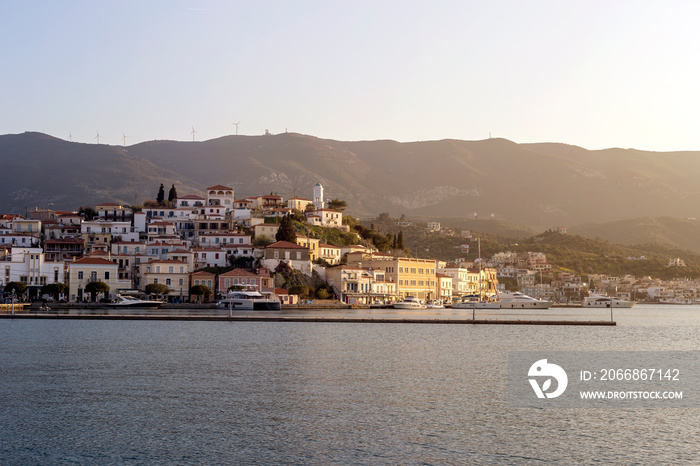 View of the embankment of the island of Poros (Greece) at sunset