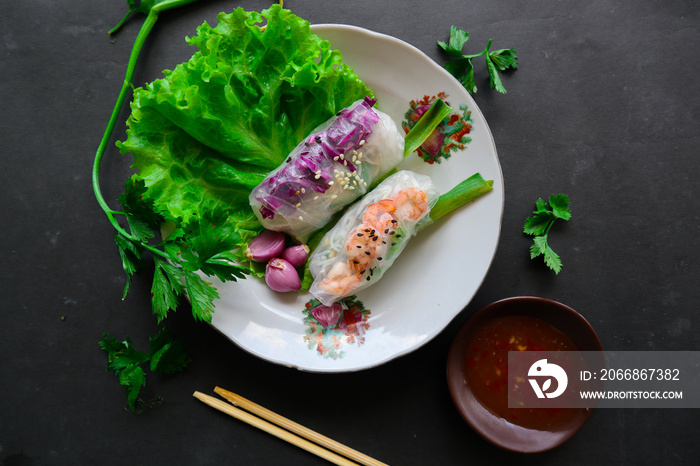 Goi cuon is a traditional spring roll from Vietnam (Vietnamese food), made from meat, shrimp, vegetables, vermicelli, wrapped in rice paper or bánh tráng. served with sauce