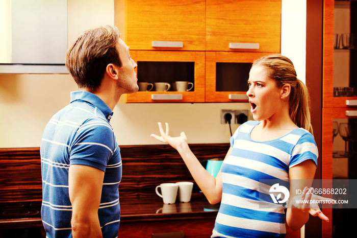 Young couple having quarrel in the kitchen