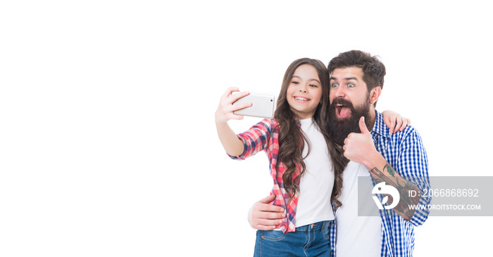 Smile to the camera. Girl child and bearded man take selfie with phone. Mobile selfie. Thumbs up