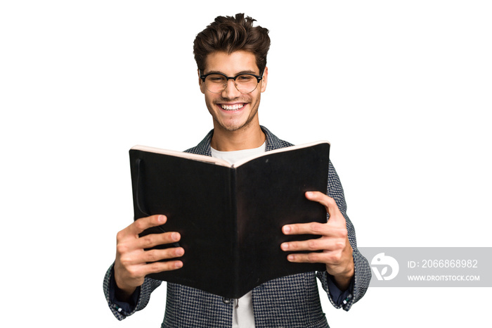 Young teacher caucasian man holding a book isolated