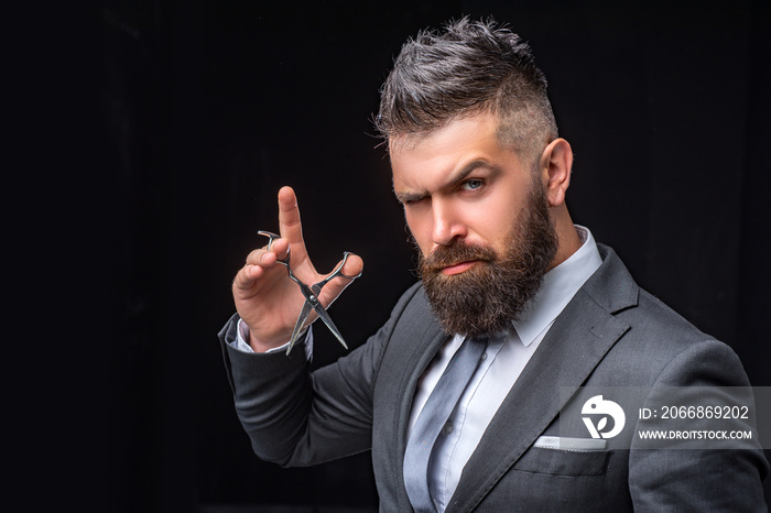 beard care. Mature hipster with beard. bearded man in formal business suit. brutal male hipster cut hair with hairdressing scissors. confident businessman at barbershop. barber and hairdresser salon