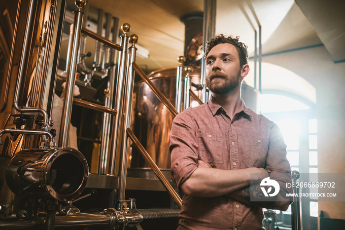 Man tasting fresh beer in a brewery