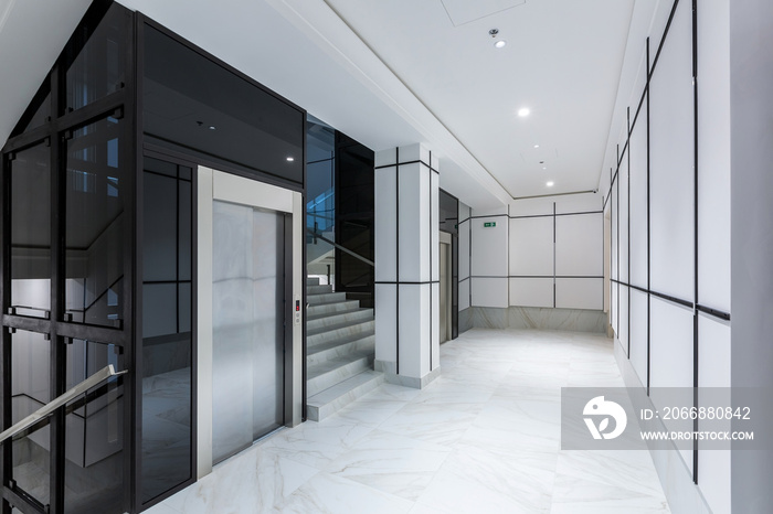 Interior photography, contemporary corridor hall business center in white tiles with Marble