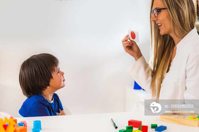 Child psychology, toddler doing logic tests with cards