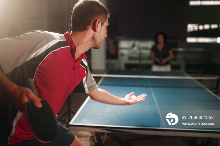 Table tennis, male player with racket and ball