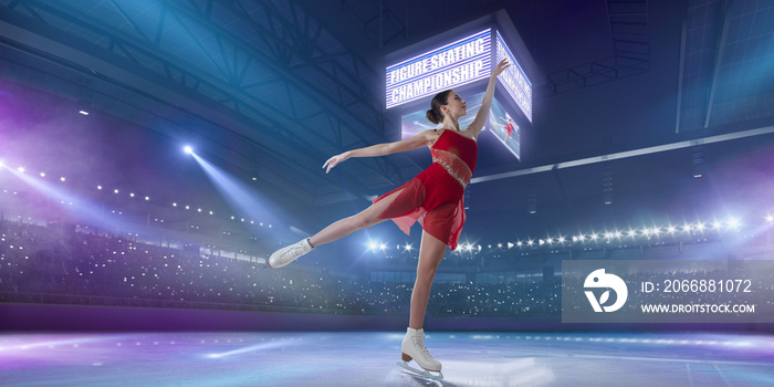 Figure skating girl in ice arena.