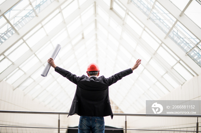 Satisfied architect with celebration gesture