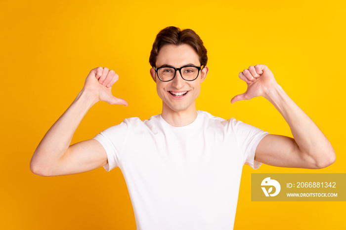 Photo of young handsome man indicate thumds himself proud branding cool isolated over yellow color background