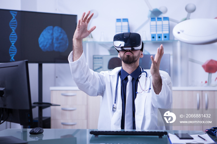 Smart doctor wearing virtual reality goggles in modern clinic office