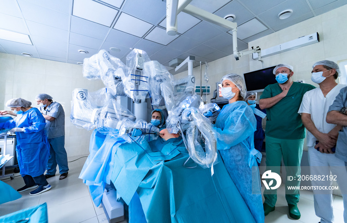 Surgical room in hospital with robotic technology equipment, machine arm surgeon in futuristic operating room. Modern surgical system. Medical robot.