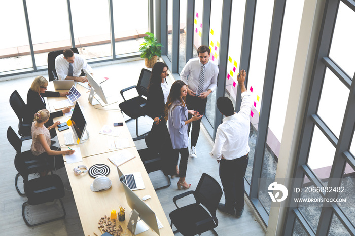 Top view group of multiethnic business man and woman busy working and meeting in conference room. people work in modern office. Professional business team success.