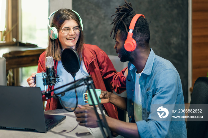 Broadcast Collaboration: African American Man and Caucasian Woman Recording Podcast