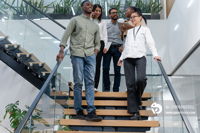 Office workers walking on steps