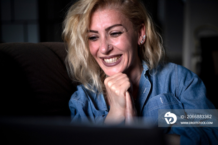 woman watching movie on laptop computer