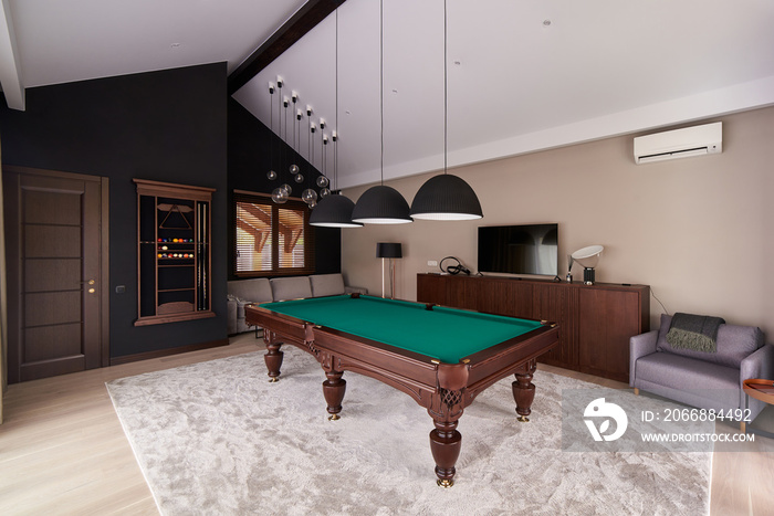 modern billiard room with a beautiful table and large windows