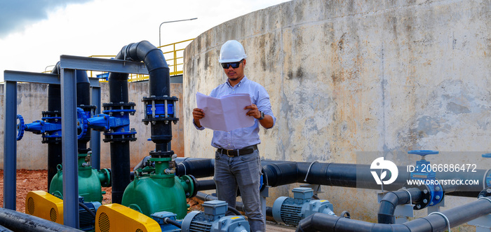 An engineer controlling a quality of water ,aerated activated sludge tank at a waste water treatment plant