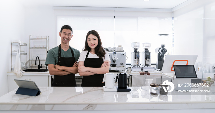 Startup successful small business owner sme boy girl stand with tablet in coffee shop restaurant. Portrait of asian tan man woman barista cafe owner. SME entrepreneur seller business delivery concept