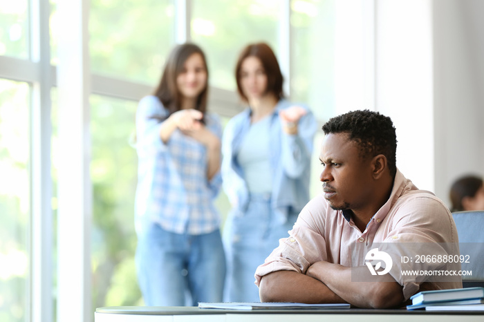 Lonely African-American man in office. Stop racism