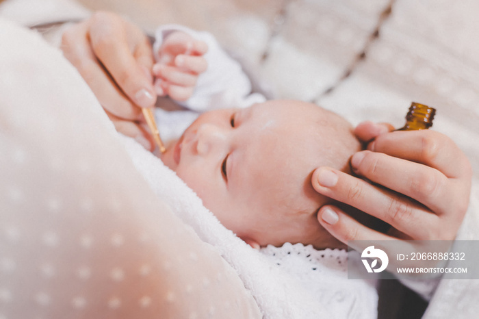 The sacrament of the baptism of a child. Selective focus.