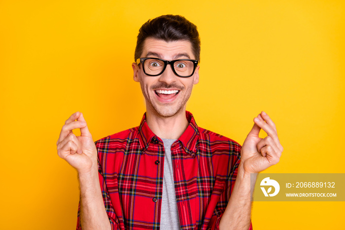 Photo of young happy positive funky funny excited crazy man showing sign asking money isolated on yellow color background