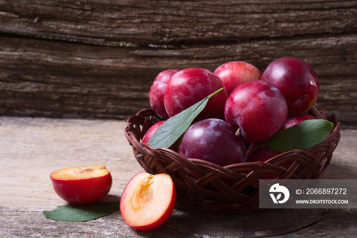 plums in basket