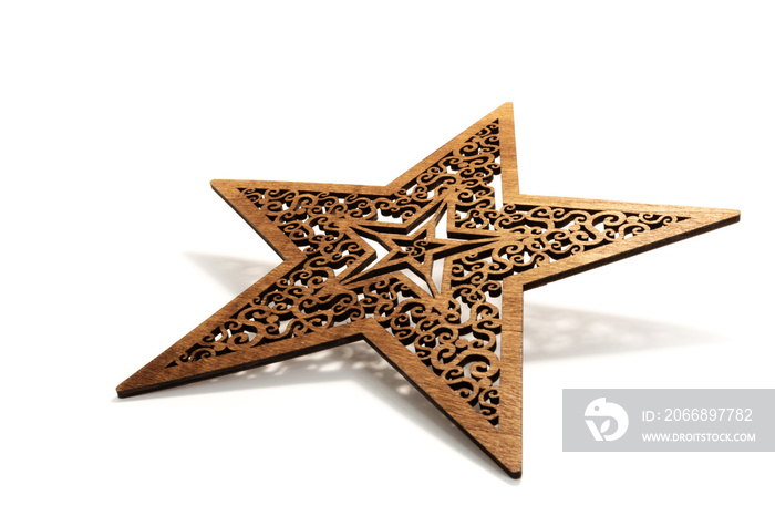 Brown star as Christmas decoration made and cut out with laser from wood with shadow on white