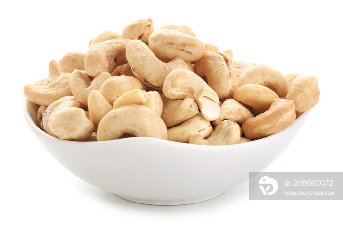 Bowl with cashew nuts on white background