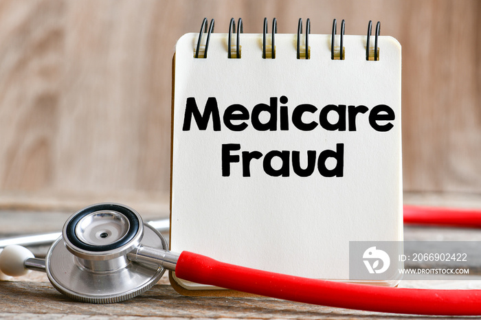 Medicare fraud spending text written in a notebook as a concept