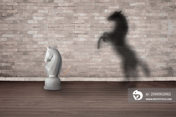 The concept of the hidden potencial. chess horse in the room which casts a shadow on the wall.