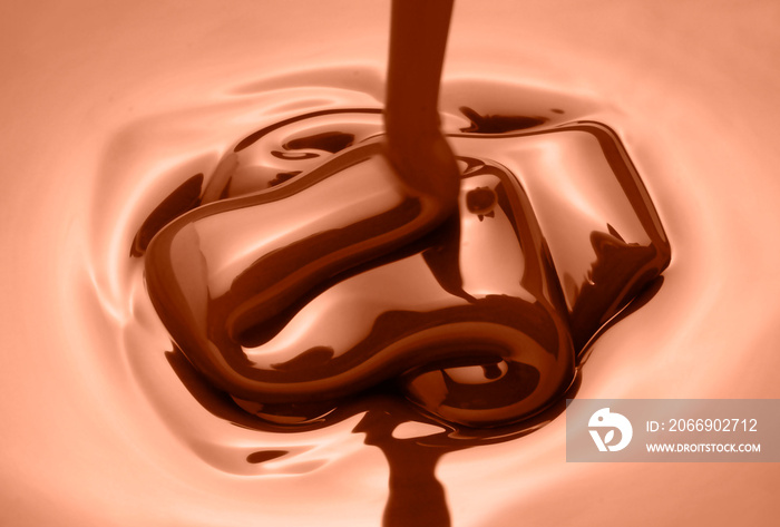 melted chocolate as it is poured to make a pastry dessert