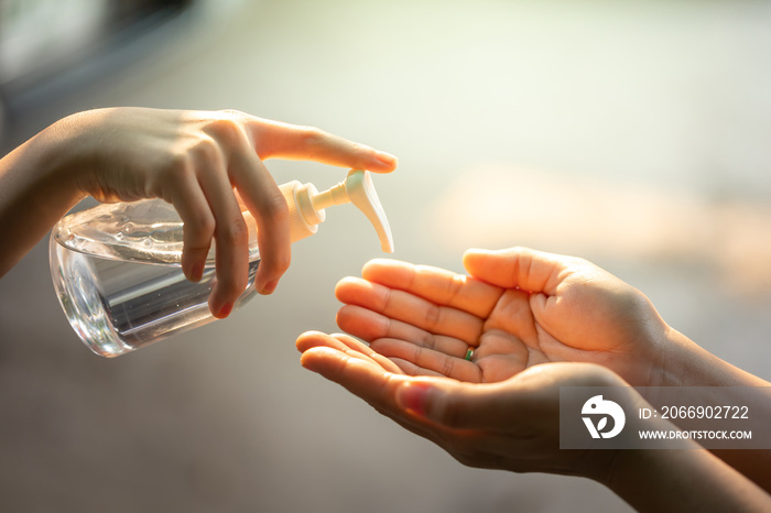 Washing hands by alcohol sanitizers.