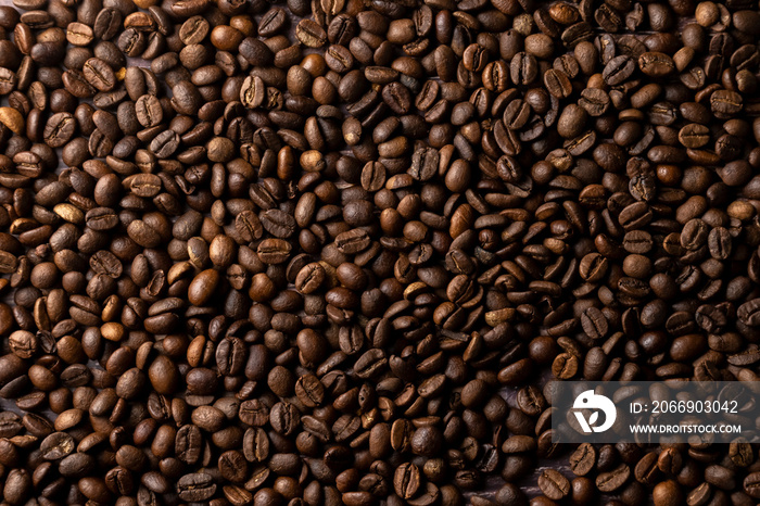 Roasted coffee beans background. Healthy beverage ingredients