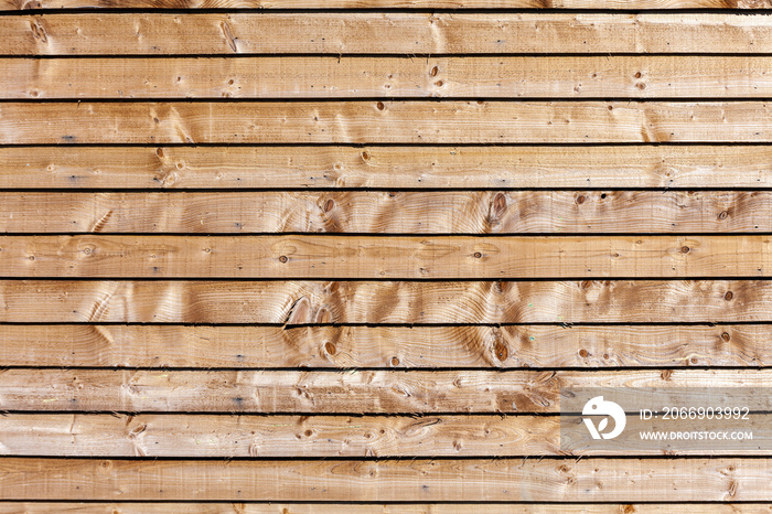 New modern brown wooden fence panel background with rough knotted grain timber texture, stock photo image