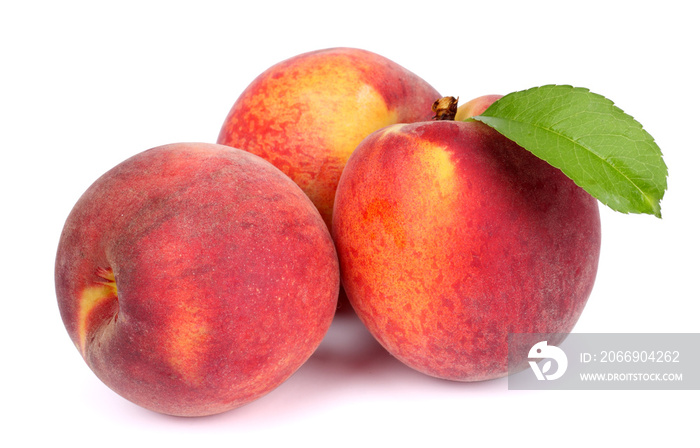 Peach. Fruit with green leaf isolated on white background