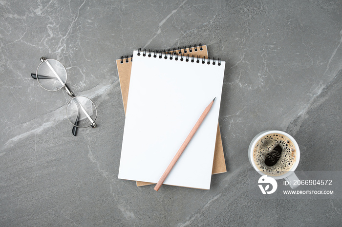 notebook with coffee on table